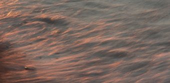 A 1-second exposure records the movement of the waves.