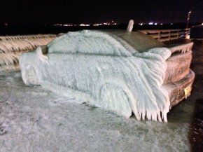 PHOTO: A car off Route 5 in Buffalo froze over from waters from Lake Eerie Sunday night and Monday morning.