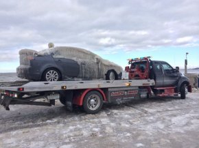 PHOTO: A car that was frozen by Lake Erie waters overnight was freed from a Hamburg, New York, parking lot on Jan. 13, 2016.